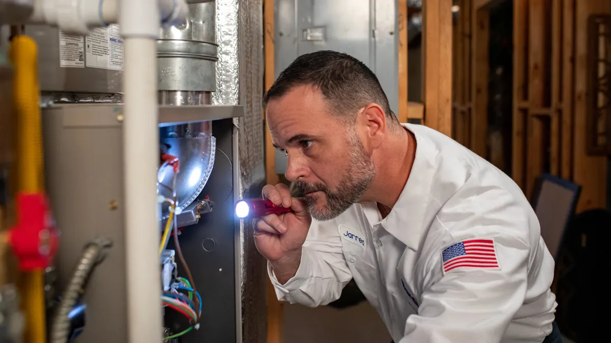 Bardi technician diagnosing a residential furnace repair