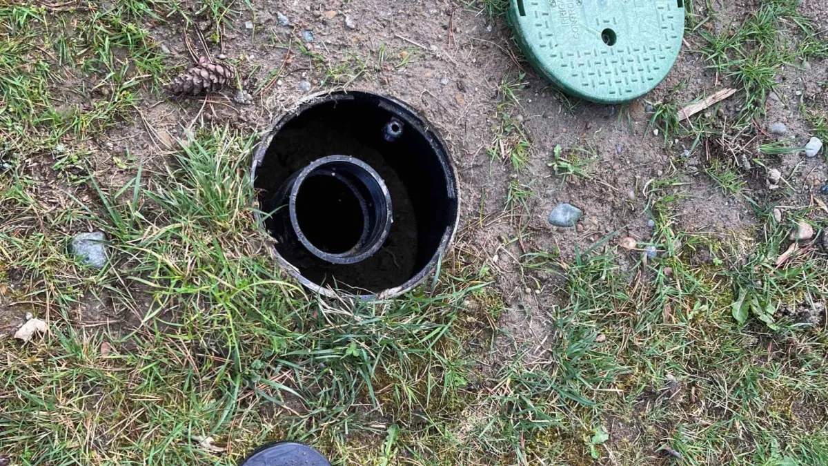 Home sewer cleanout access during sewer line inspection.