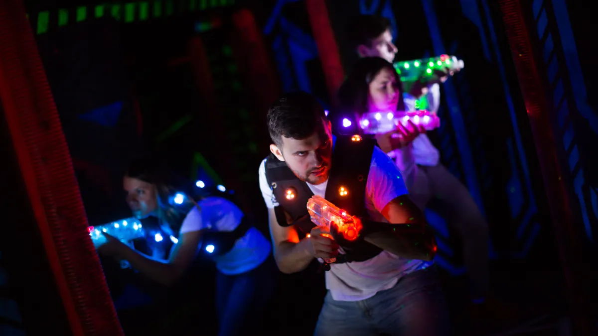 a group of people playing laser tag Suwanee, GA