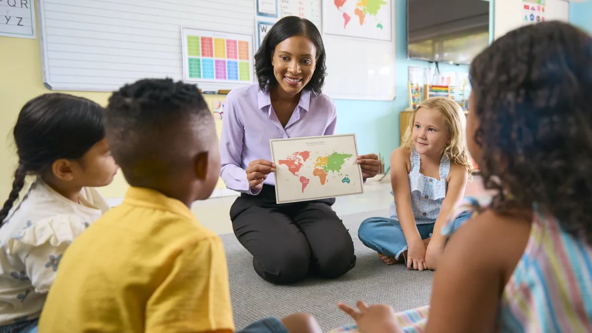 a teacher teaching her students with autism at Elevation Autism