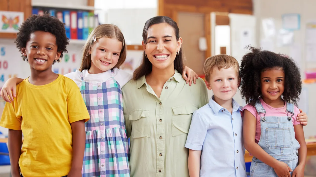 a therapist with a group of autistic children doing ABA therapy