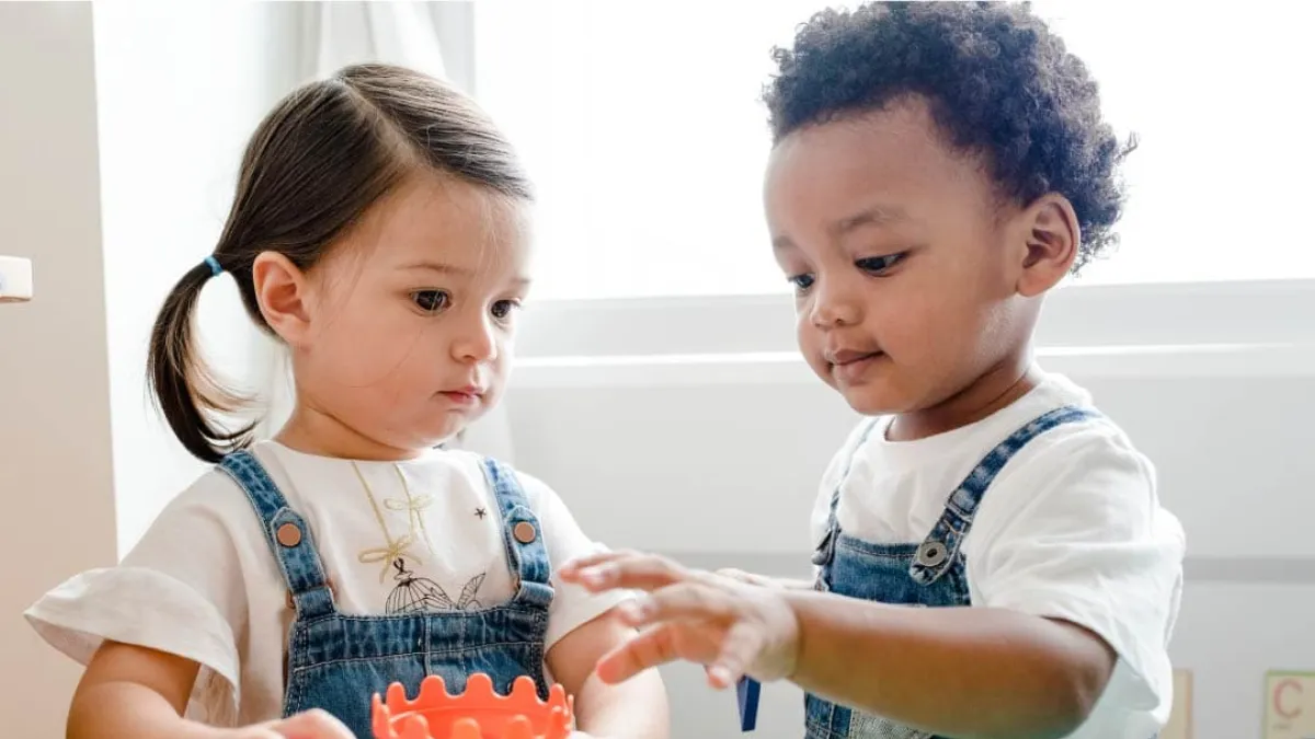 a young girl and a young boy with autism playing at Elevation Autism
