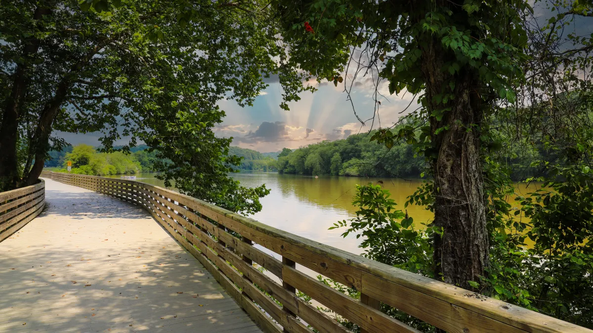 a wooden bridge over a body of water in Roswell, GA