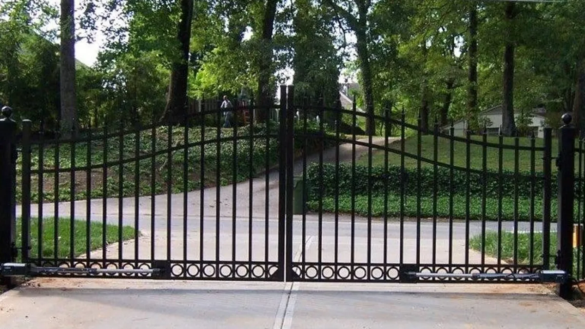 a gate with trees in the background