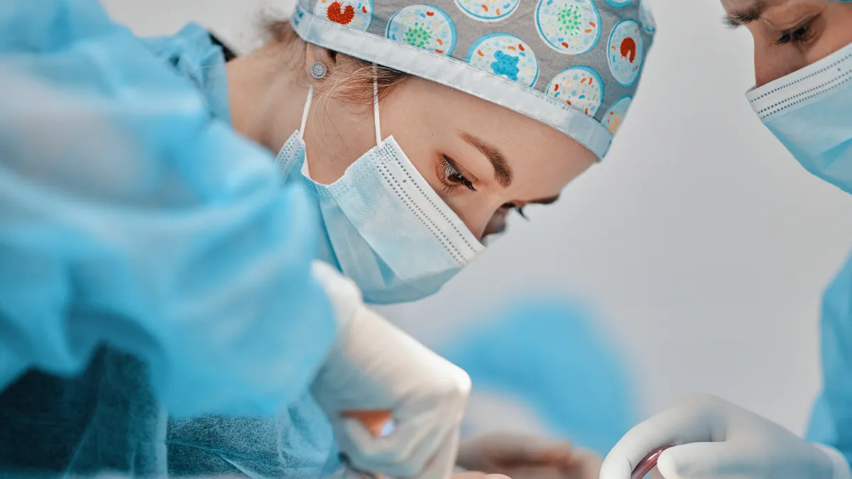 a group of surgeons performing surgery