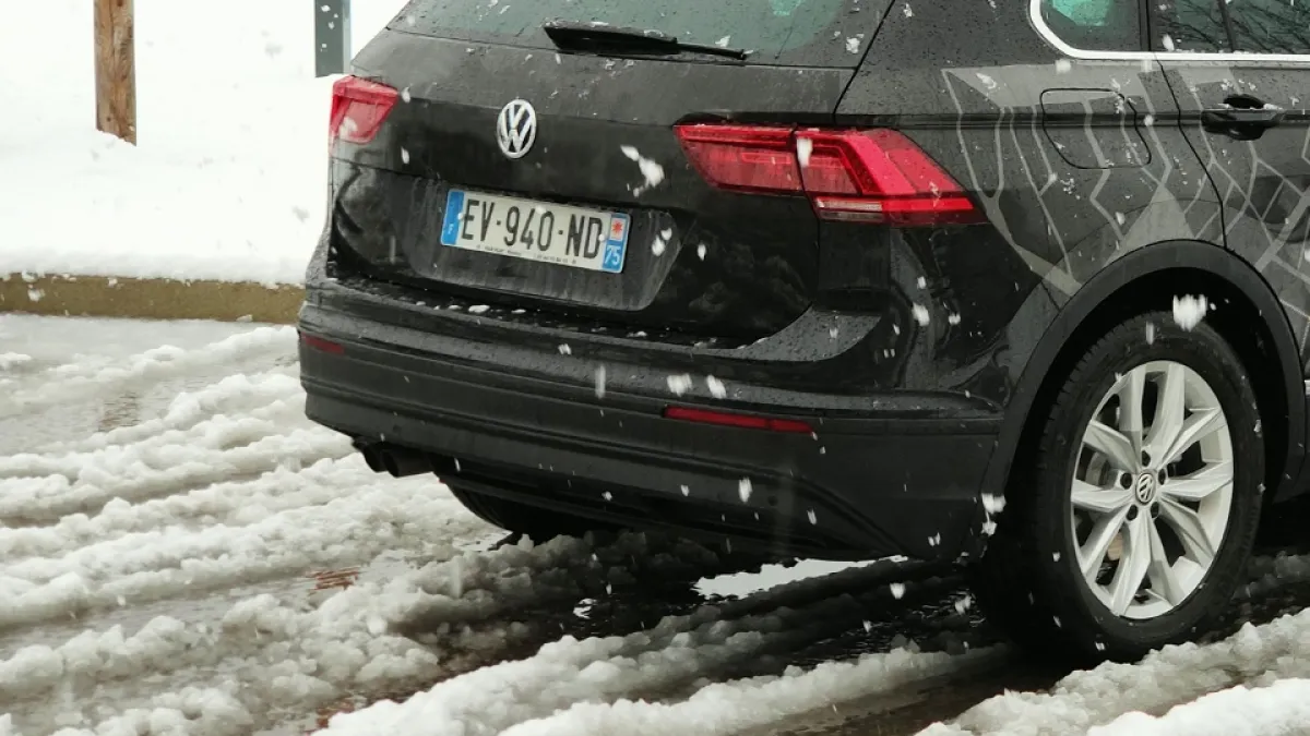 a black car parked in the snow