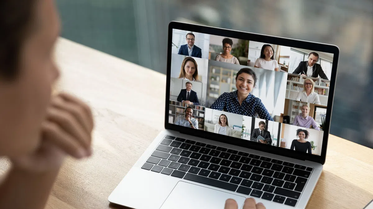 a laptop with a man's face on the screen