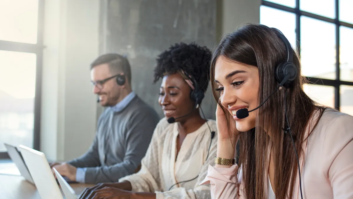 Michelle Davis et al. looking at a laptop