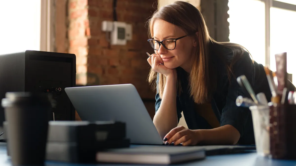 a woman working on her laptop