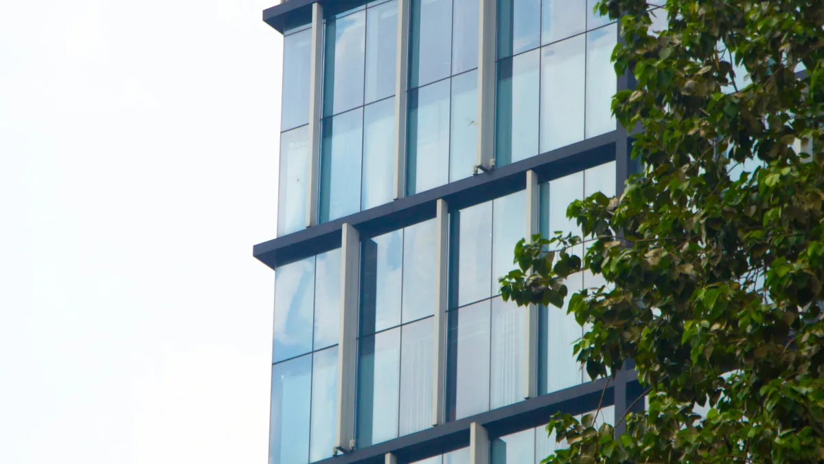 a tall building with a tree in front of it