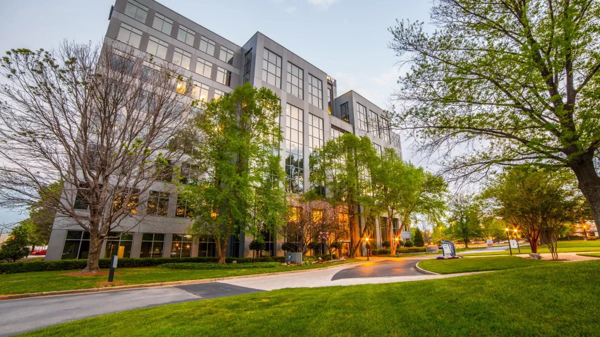 a building with trees in front of it