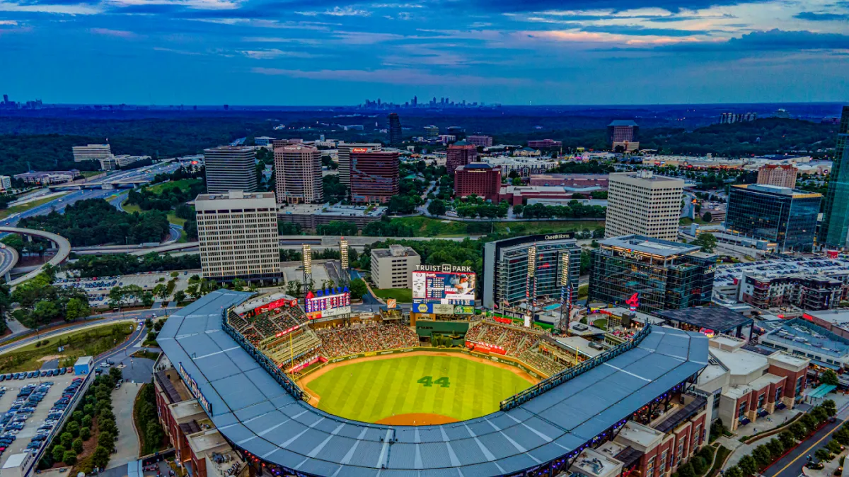 a stadium with a field in the middle of a city