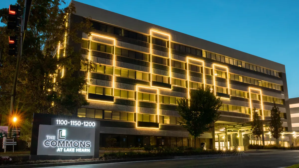 a large building with a sign in front of it