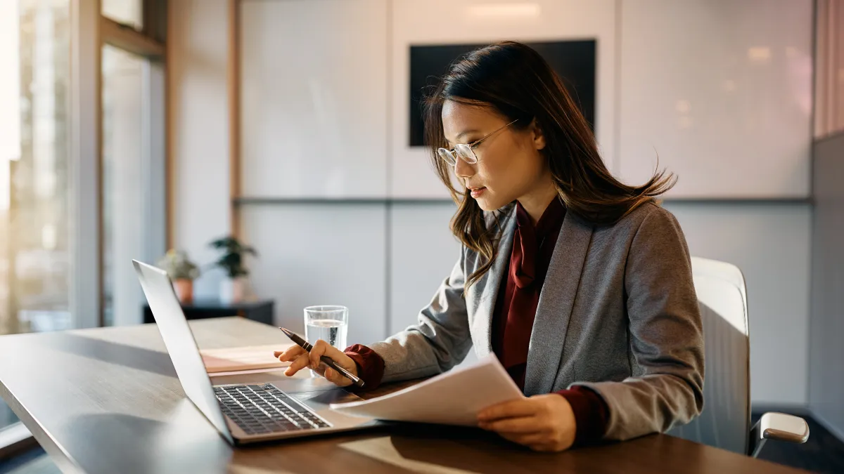 a woman working on her laptop