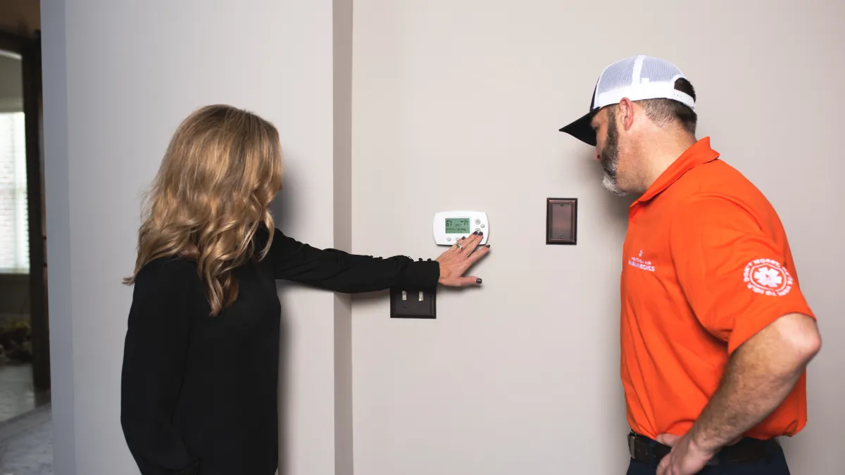 Heating + Air Paramedics technician called to repair a thermostat in a North Carolina home