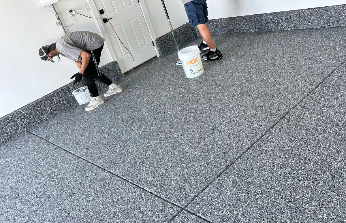 men cleaning garage floor