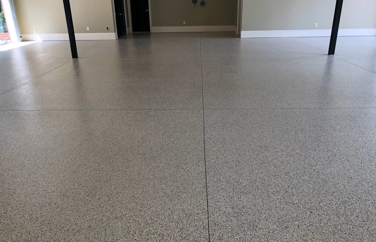 garage floors with beams and a door