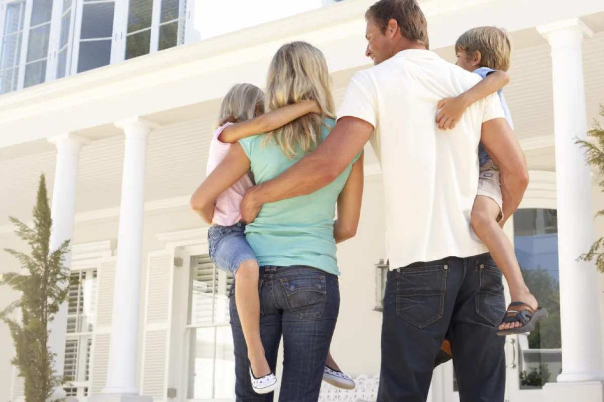 a group of people standing in front of a building