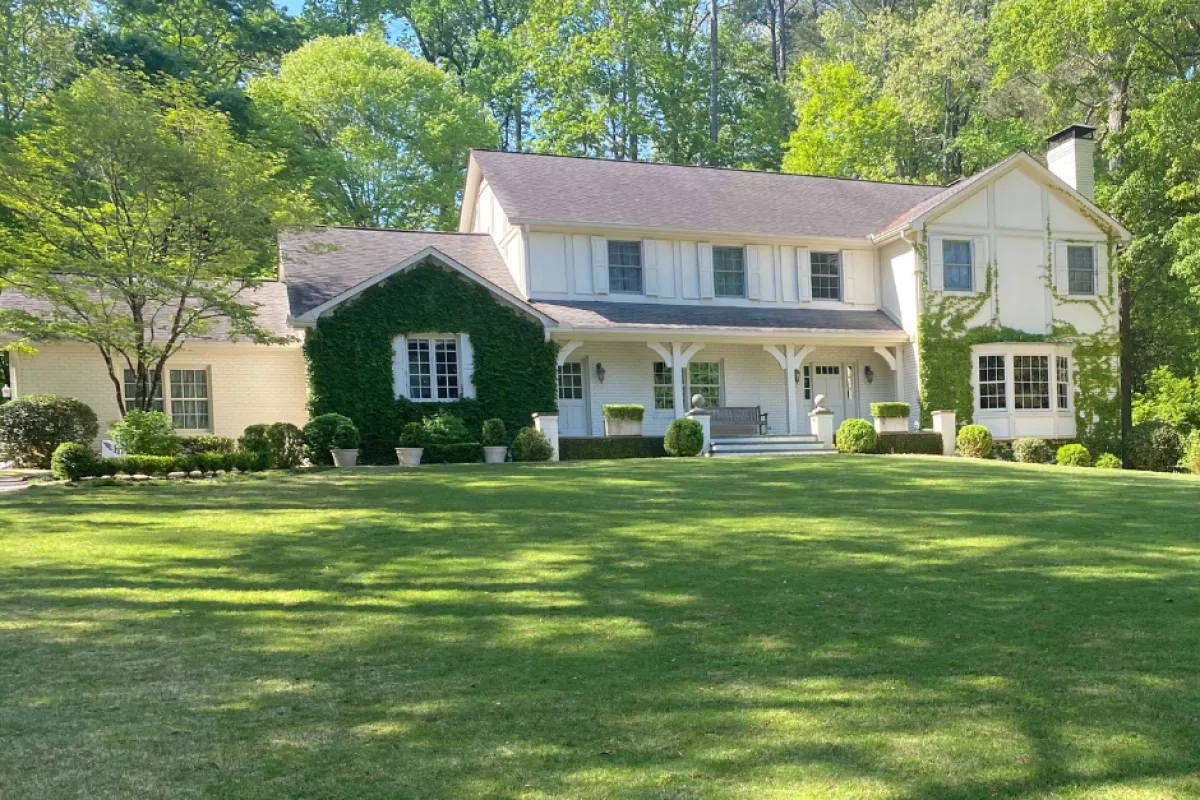 a large house with a lawn in front of it