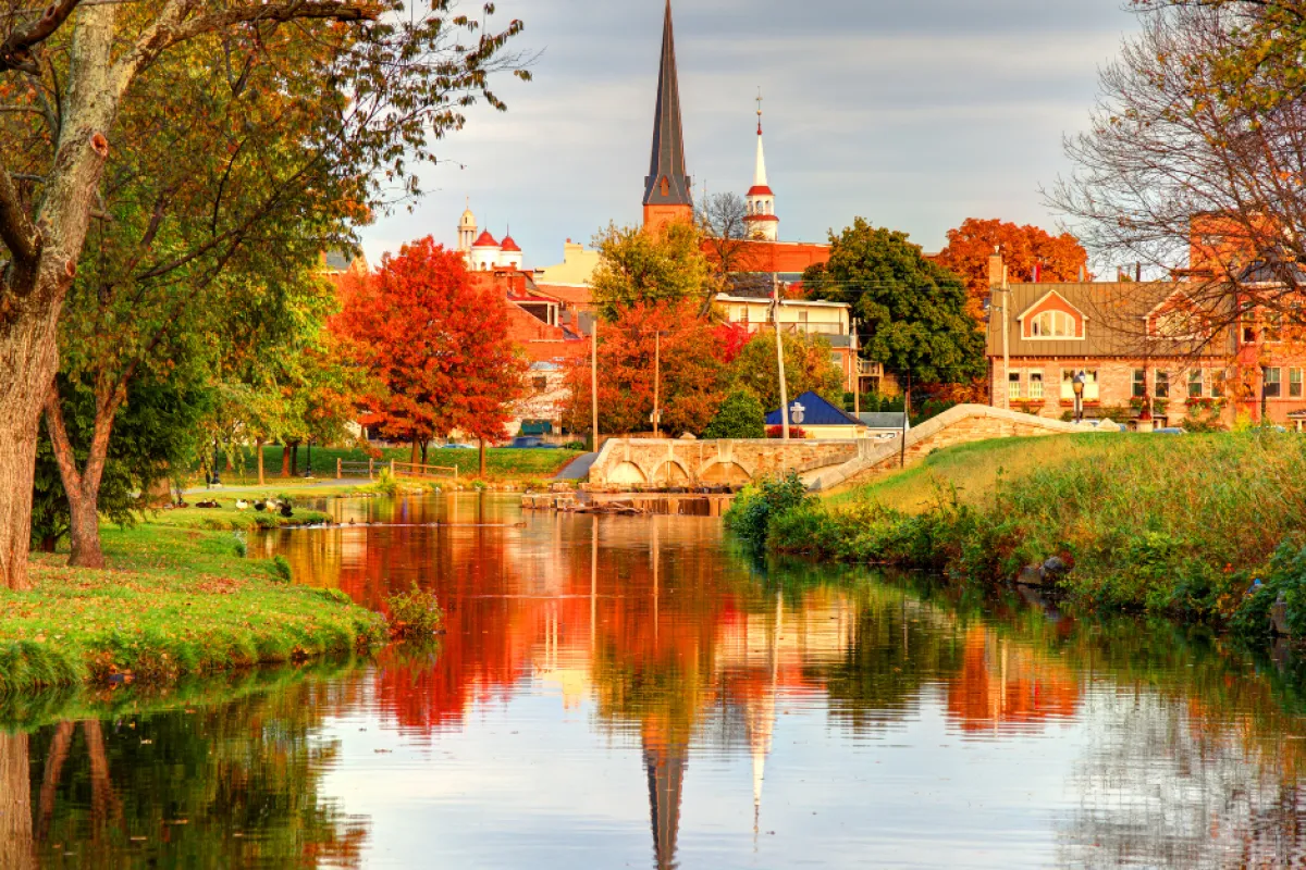 a river with a church in the background