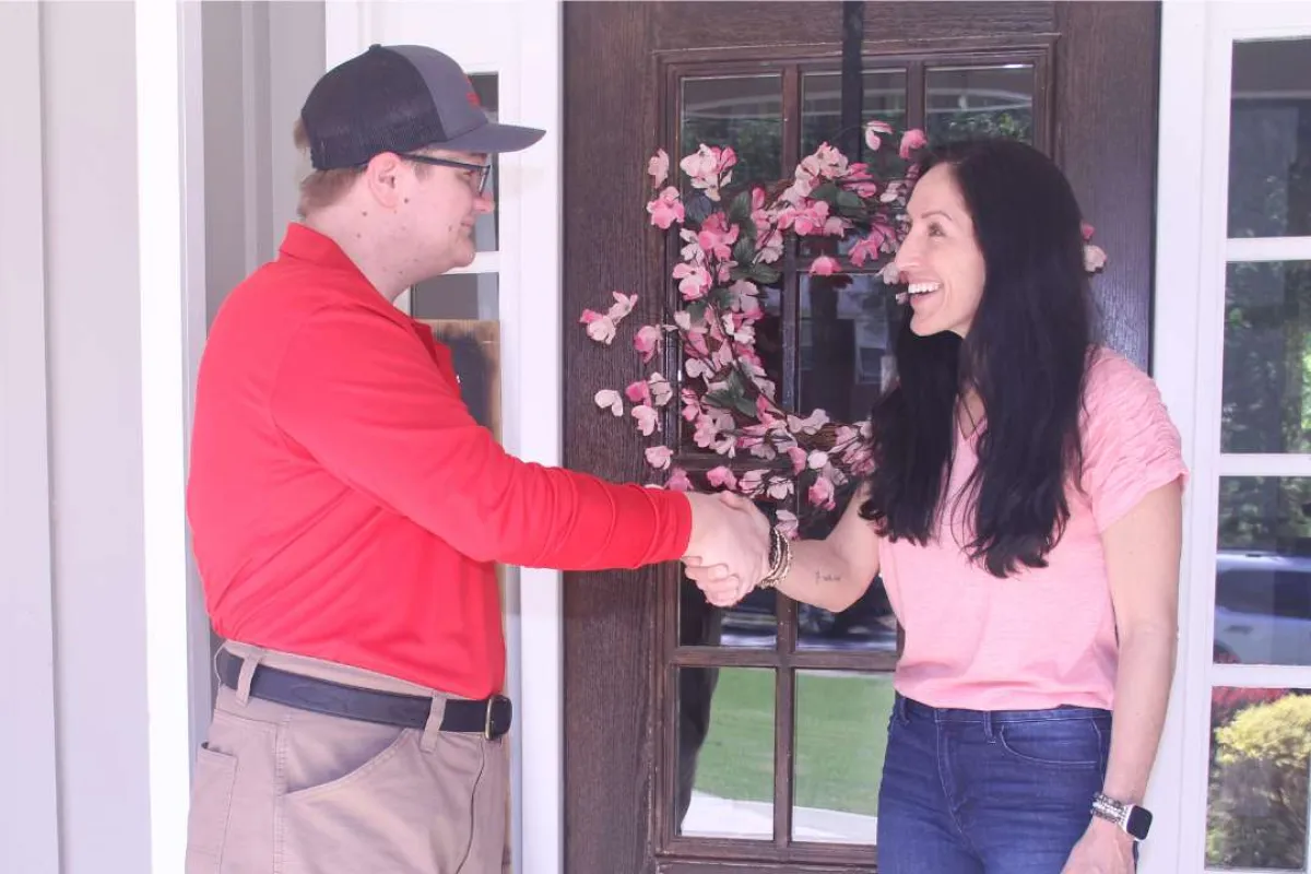 Palmetto Exterminator employee greeting a homeowner