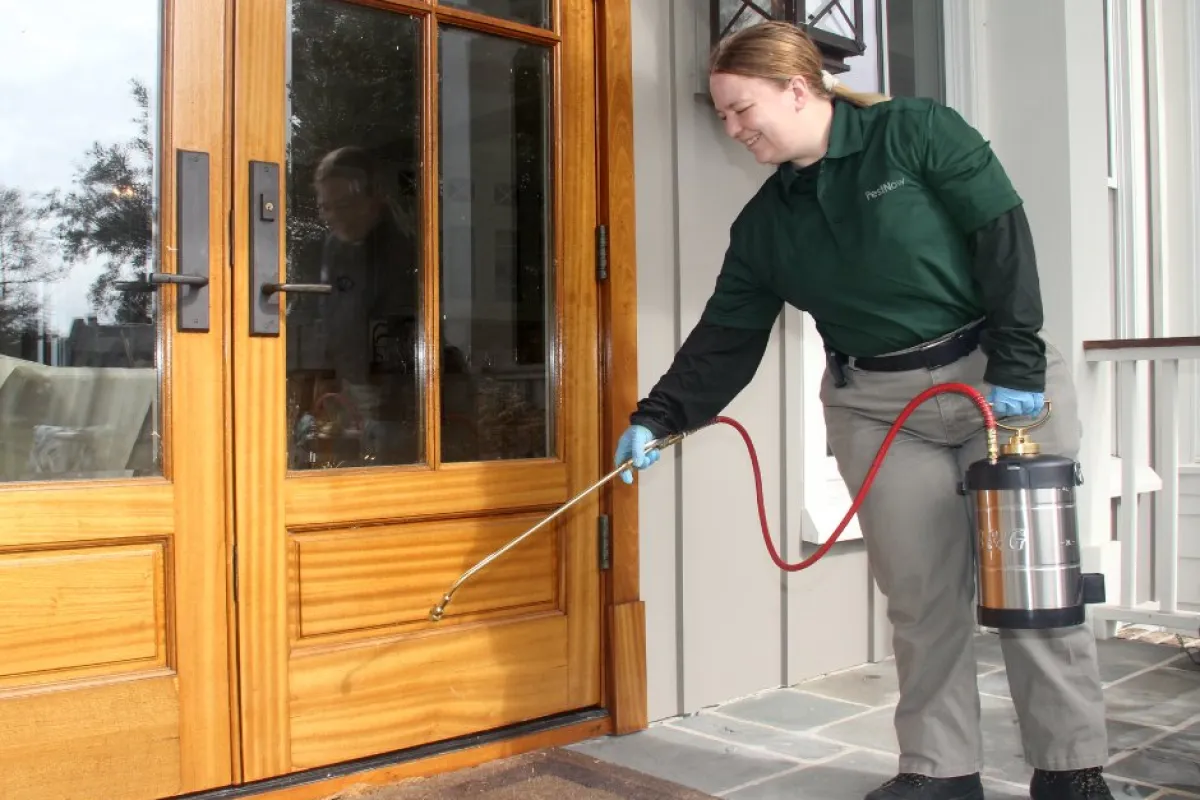 Pest Control being applied outside of home