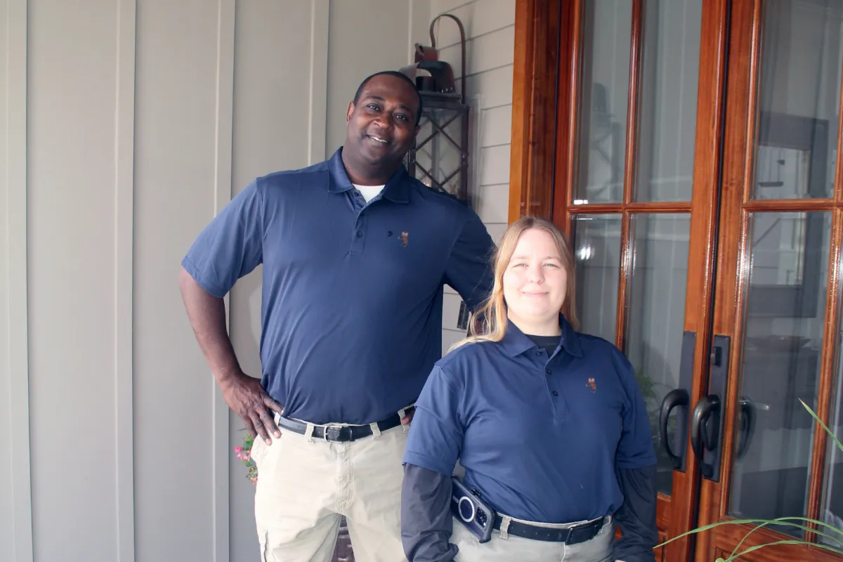 a man and a woman standing outside a building