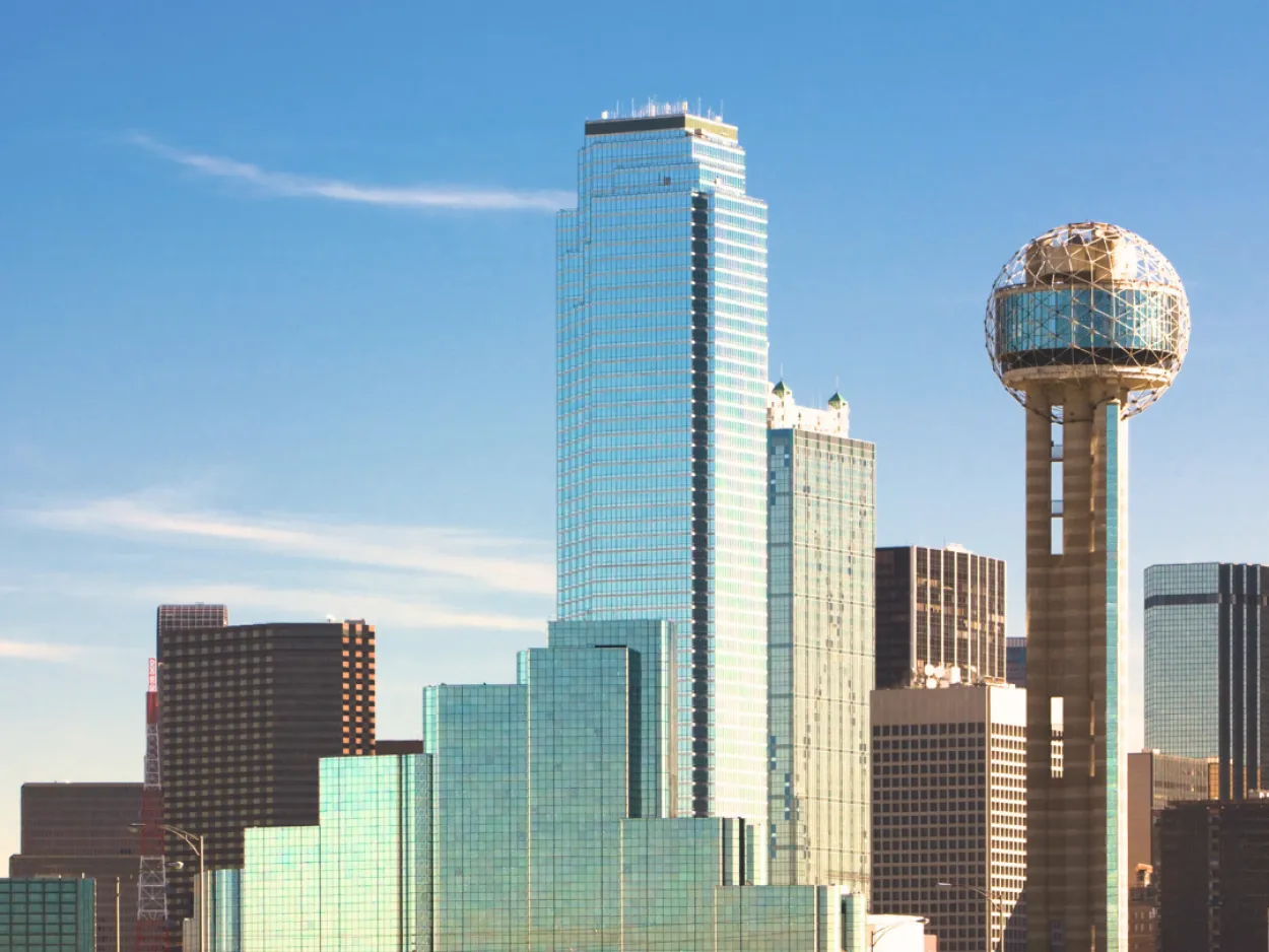 a city skyline with a globe