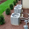Air conditioners next to a home