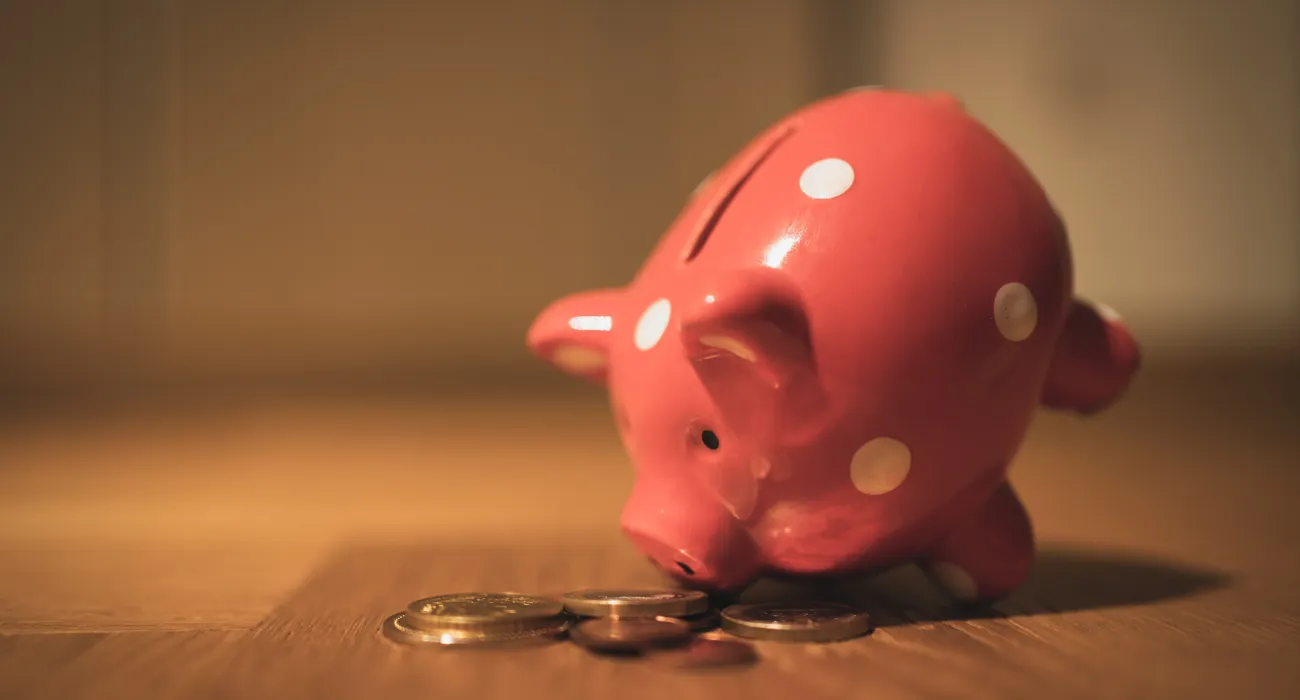 a pink piggy bank on a table