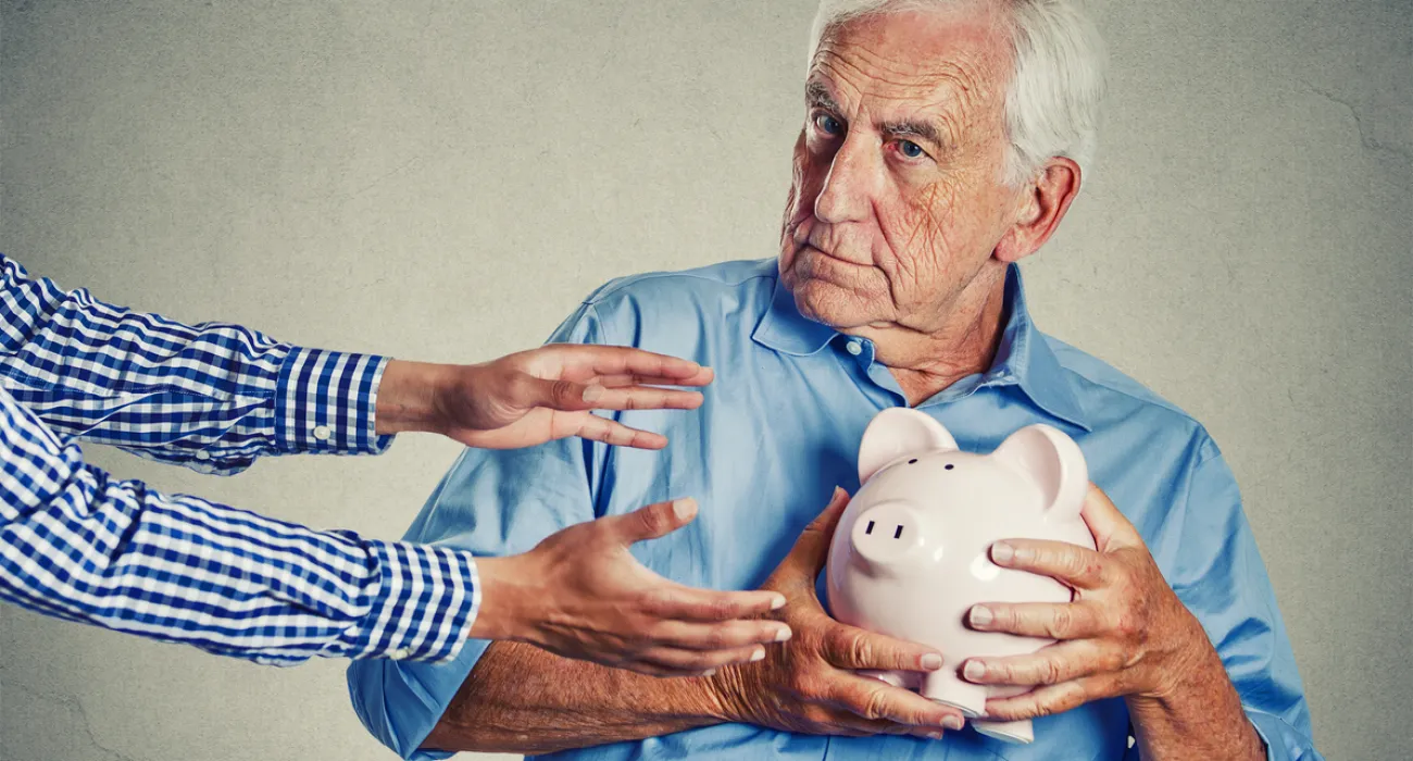 a man holding a piggy bank