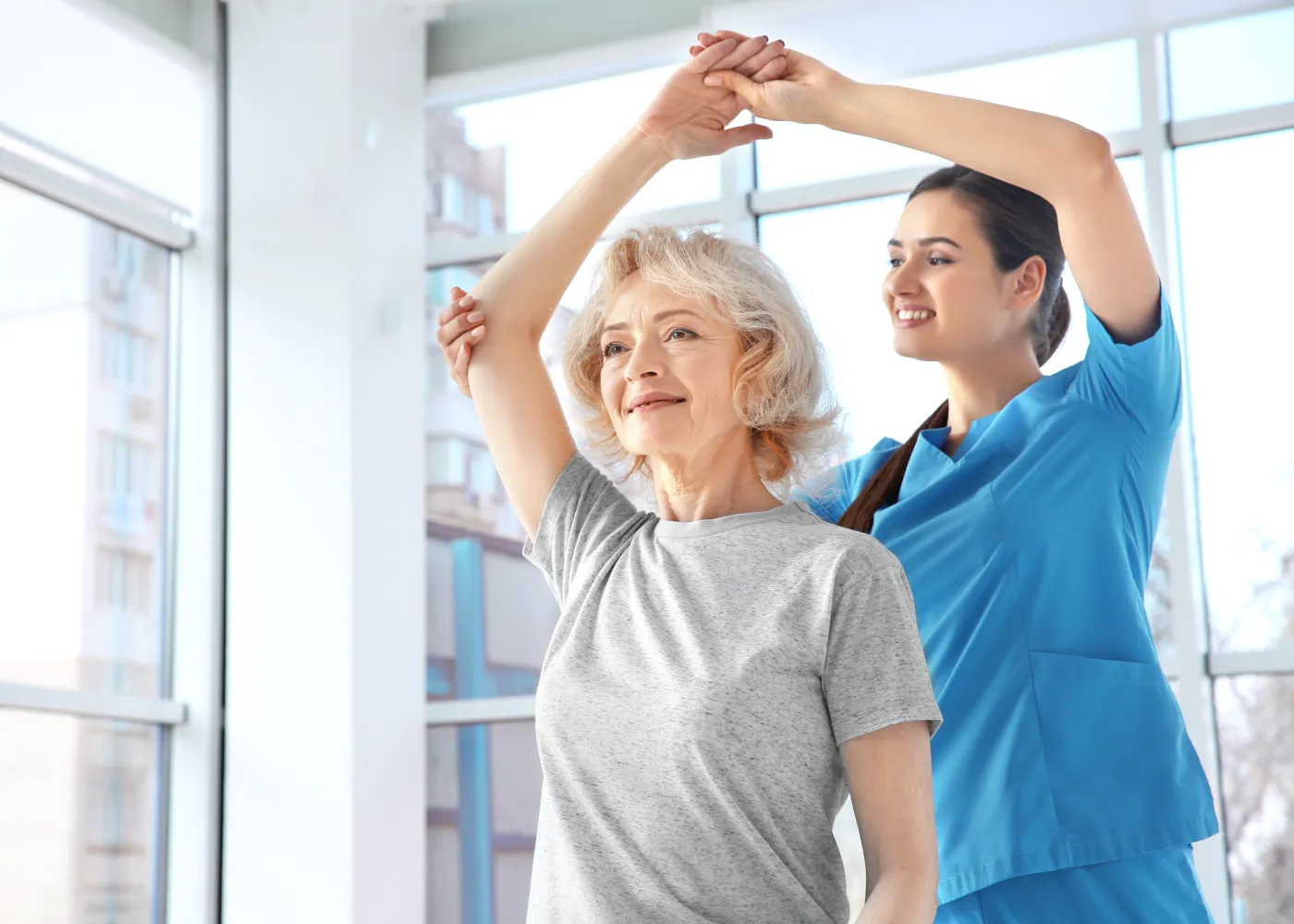 a woman and a man raising their hands