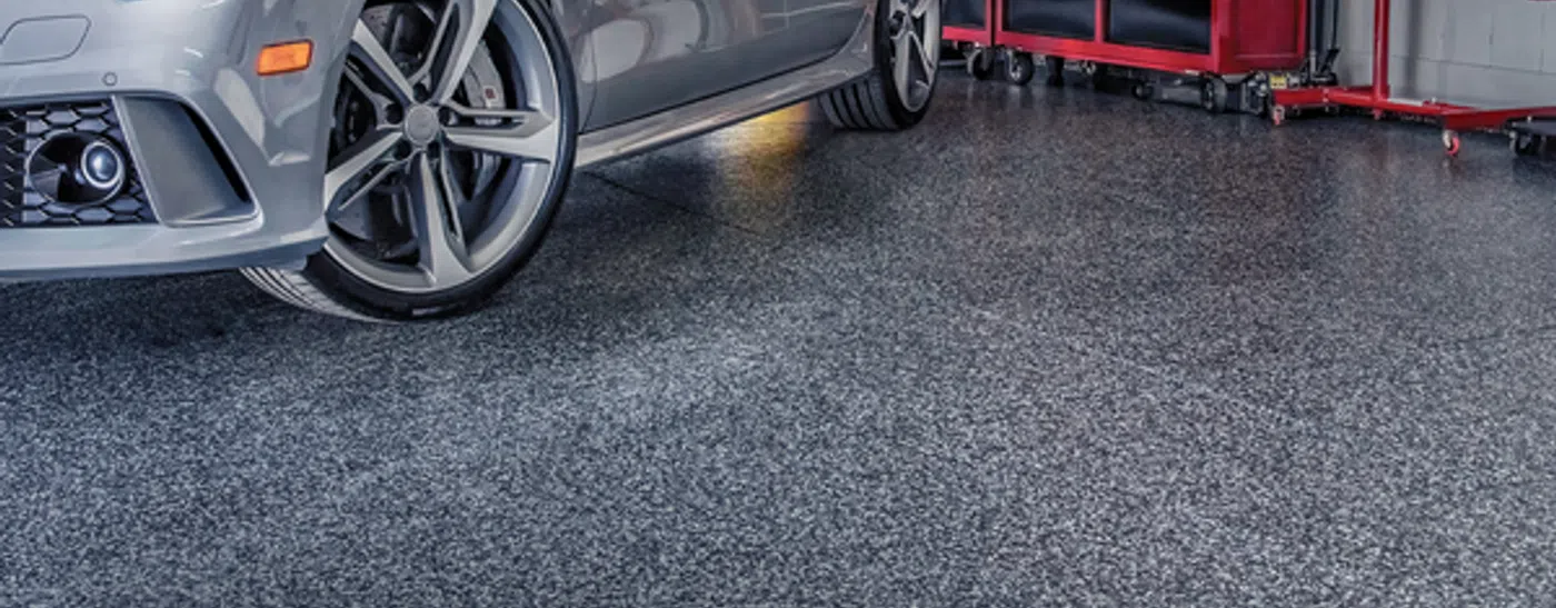 sports car on a new garage flooring provided by Granite Garage Floors