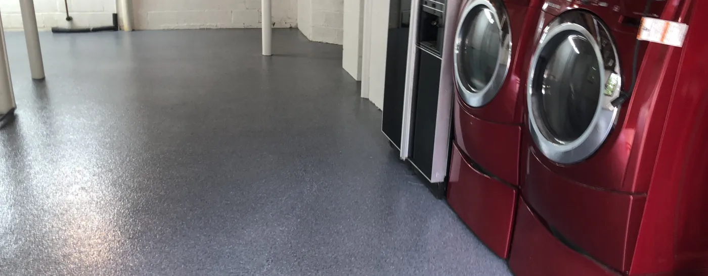 washer and dryer on garage flooring in Papillion