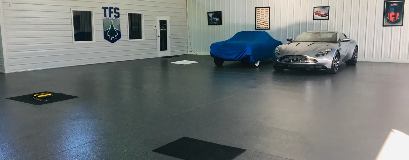 2 cars in a garage on Epoxy Flooring in Gotha