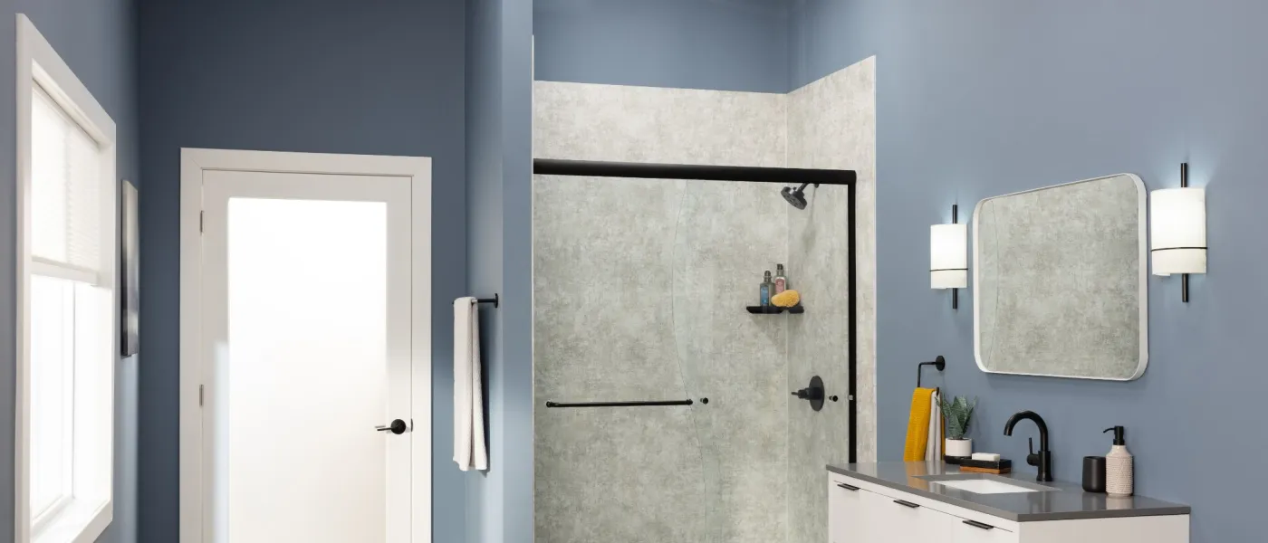 a bathroom with a sink and a shower unit