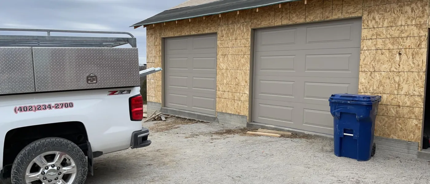 a truck parked in front of a garage