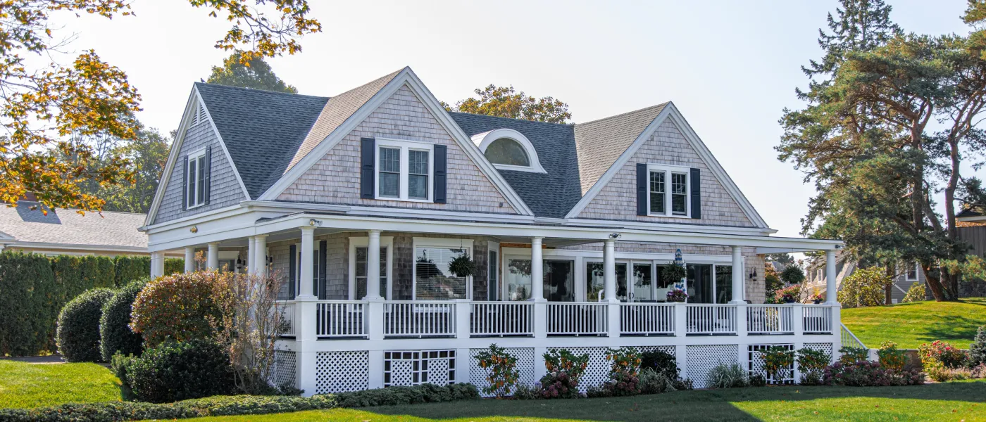 a large house with a lawn in front of it