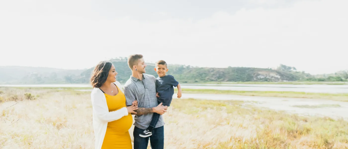 a group of people standing in a field