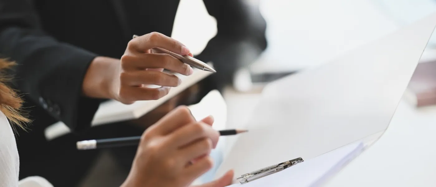 a person holding a pen