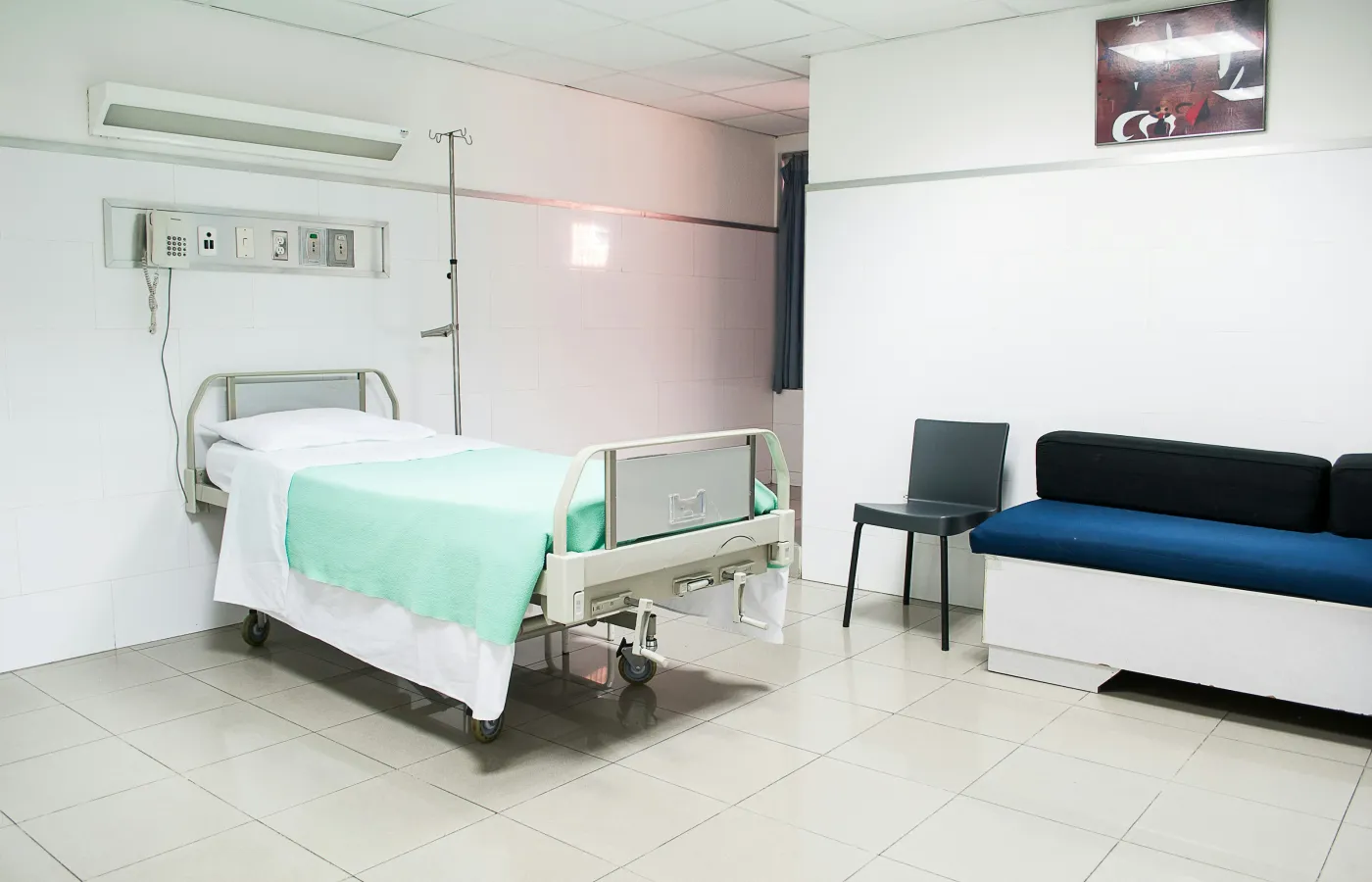 a room with a bed and a chair