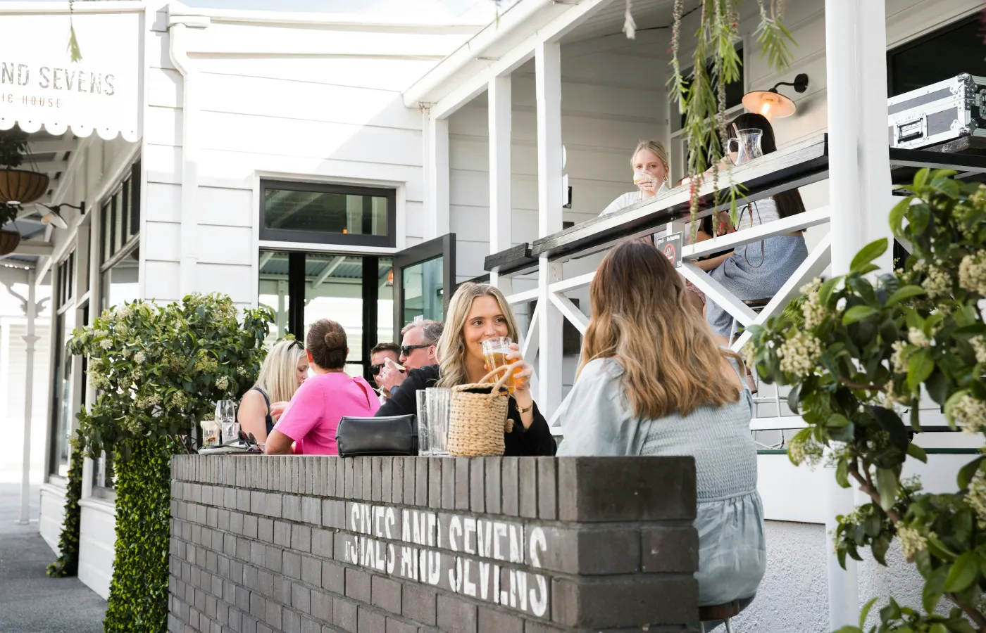 a group of people sitting outside a building