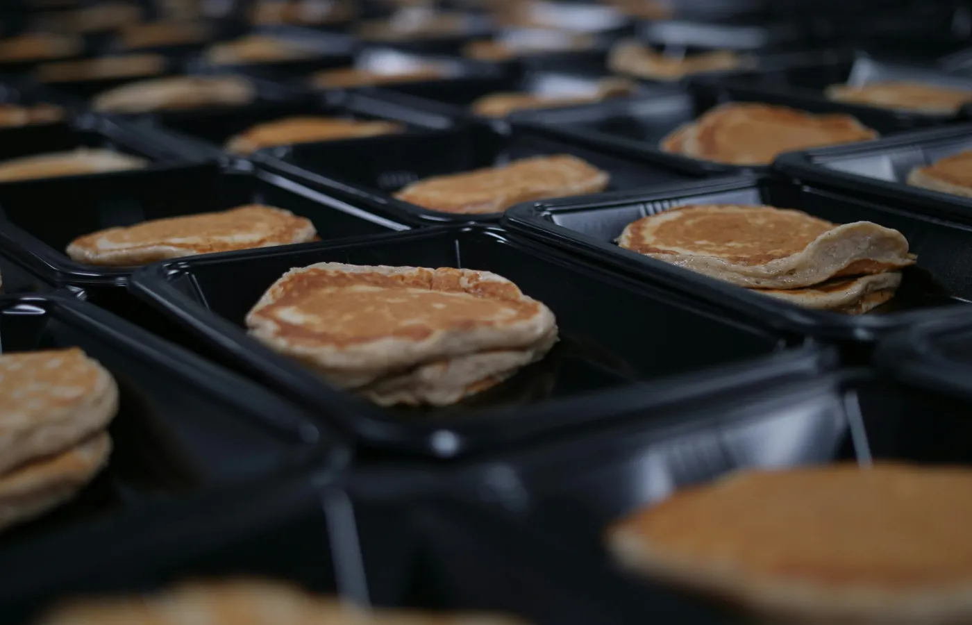 a group of pastries on a grill