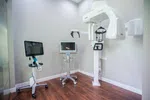 Modern dental imaging room with advanced 3D X-ray machine