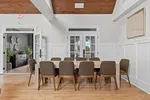 a dining room with a table and chairs