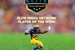 Football player Justice Haynes in Michigan uniform running with the ball, Elite Media Network Player of the Week.