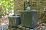 AC Residential Repair in Smyrna by The Air Company of GA. Two outdoor air conditioning units .