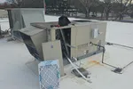 Commercial HVAC Repair and Maintenance on an RTU by The Air Company of GA.