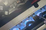 Furnace Heating Repair in Atlanta Decatur 30030 by The Air Company of GA.  Blue flames burning on multiple gas burner ports inside a furnace heating unit with wiring and metal components.
