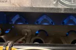 Heating Furnace Repair in Brookhaven Atlanta 30319 by The Air Company of GA.  HVAC furnace internals showing burner tubes, wiring, and metal components with blue flame visible.